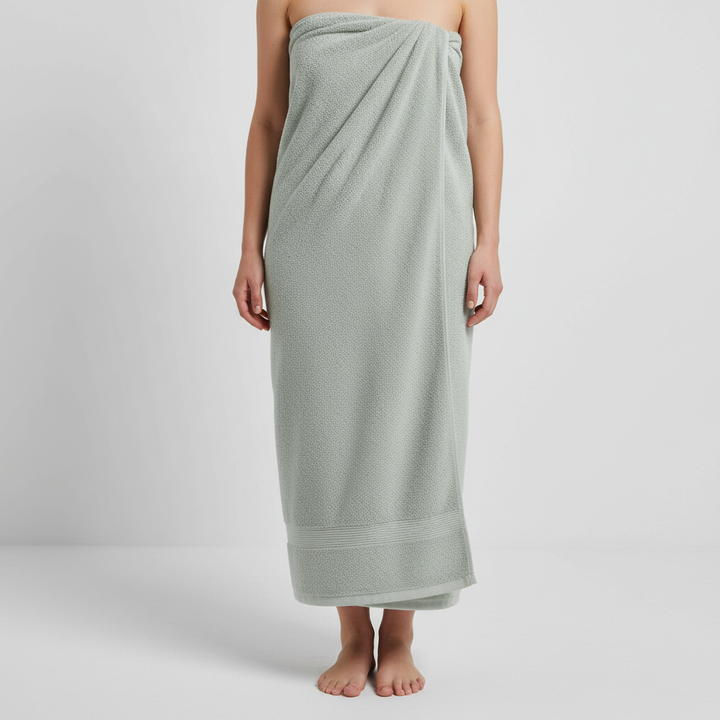 Soft XXL cotton towel, held up to show its generous dimensions and quick-dry properties