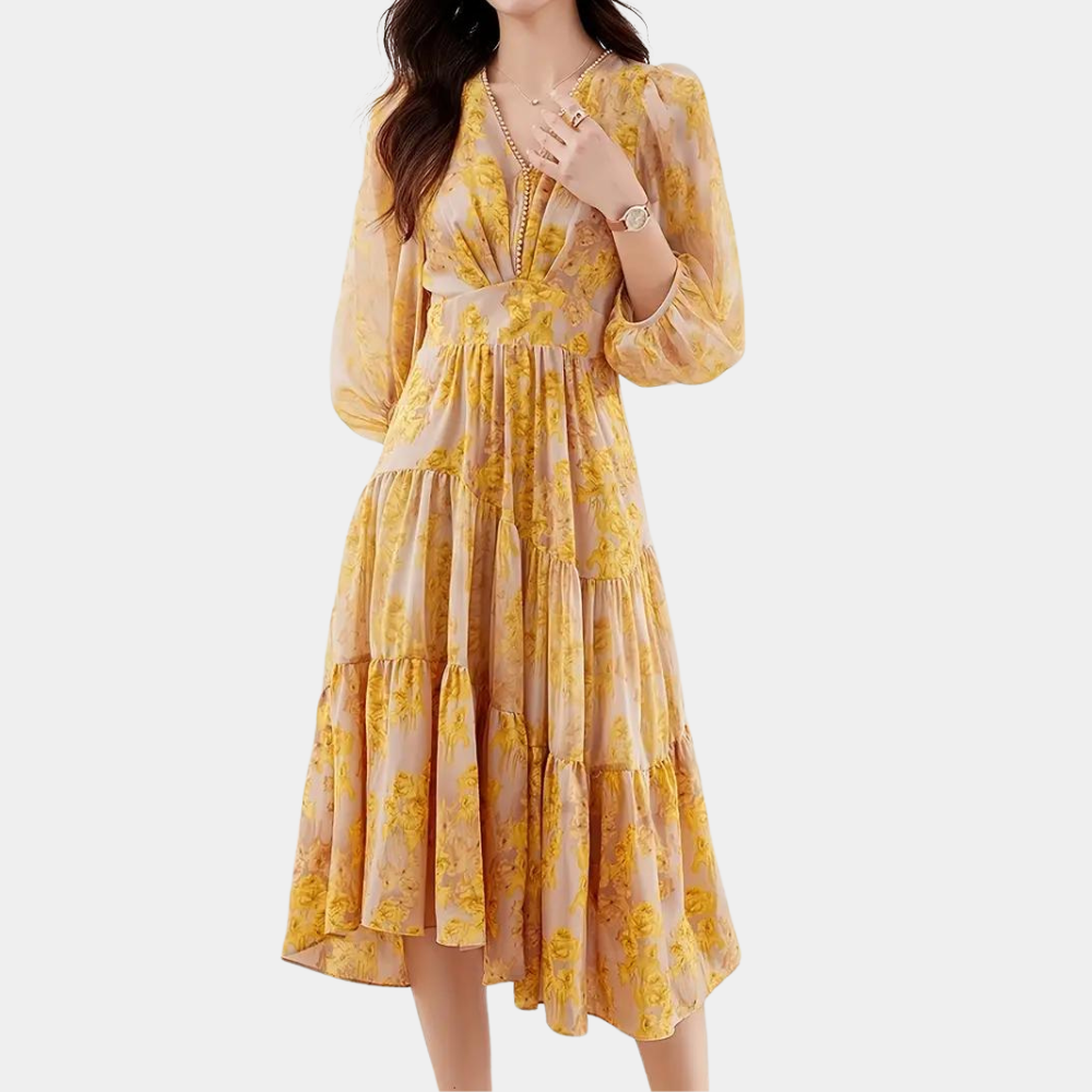 Elegant women's maxi dress in yellow with a charming floral pattern, ideal for summer parties.