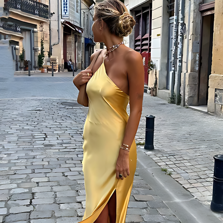 Yellow women's open-back summer dress, flowy and elegant, perfect for sunny days and effortless style.